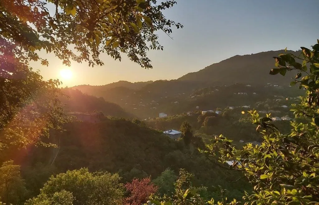 Sunset over the forested hills around Khala on the road to Mtirala
