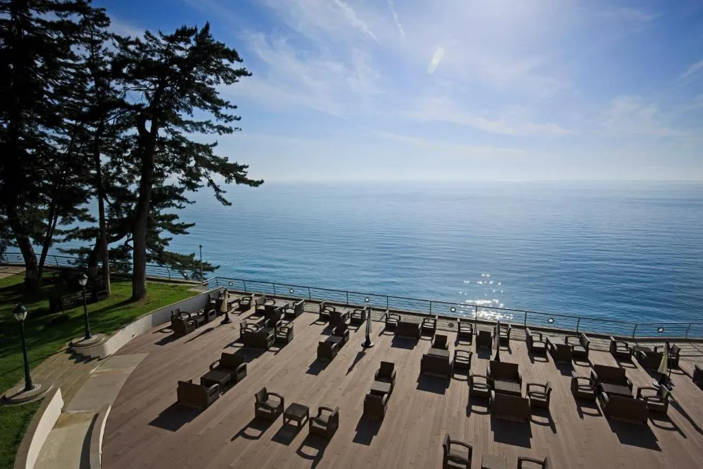 A sun terrace with loungers above the Black Sea at Castello Mare