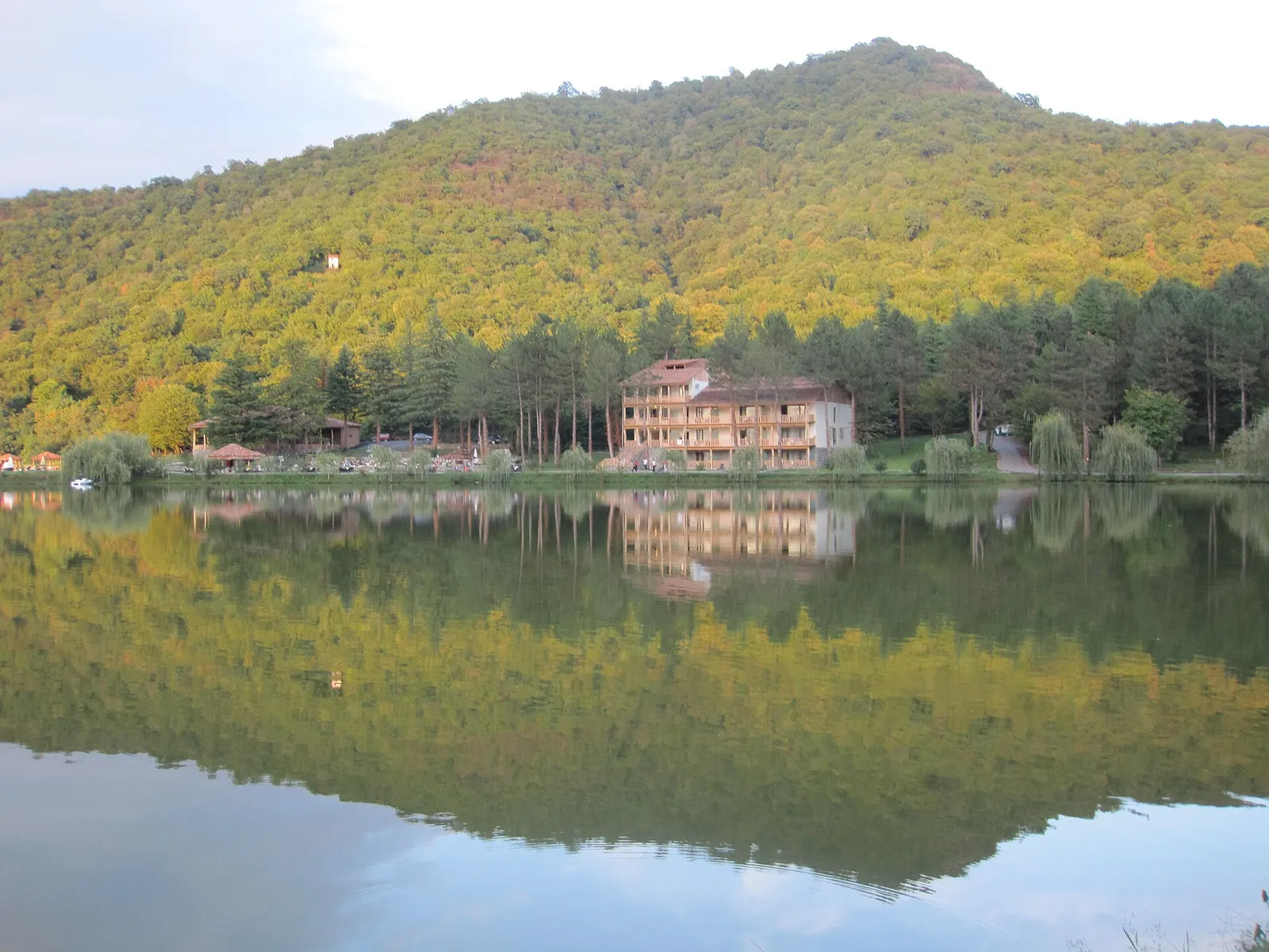 Lopota lake in Kakheti with forested hills around it