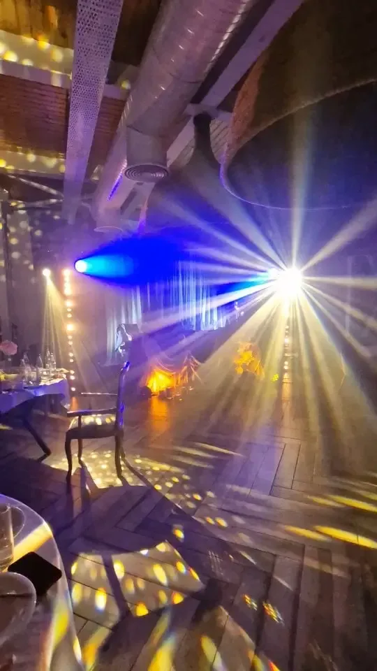 Coloured light beams from a Show Service light set-up at an event
