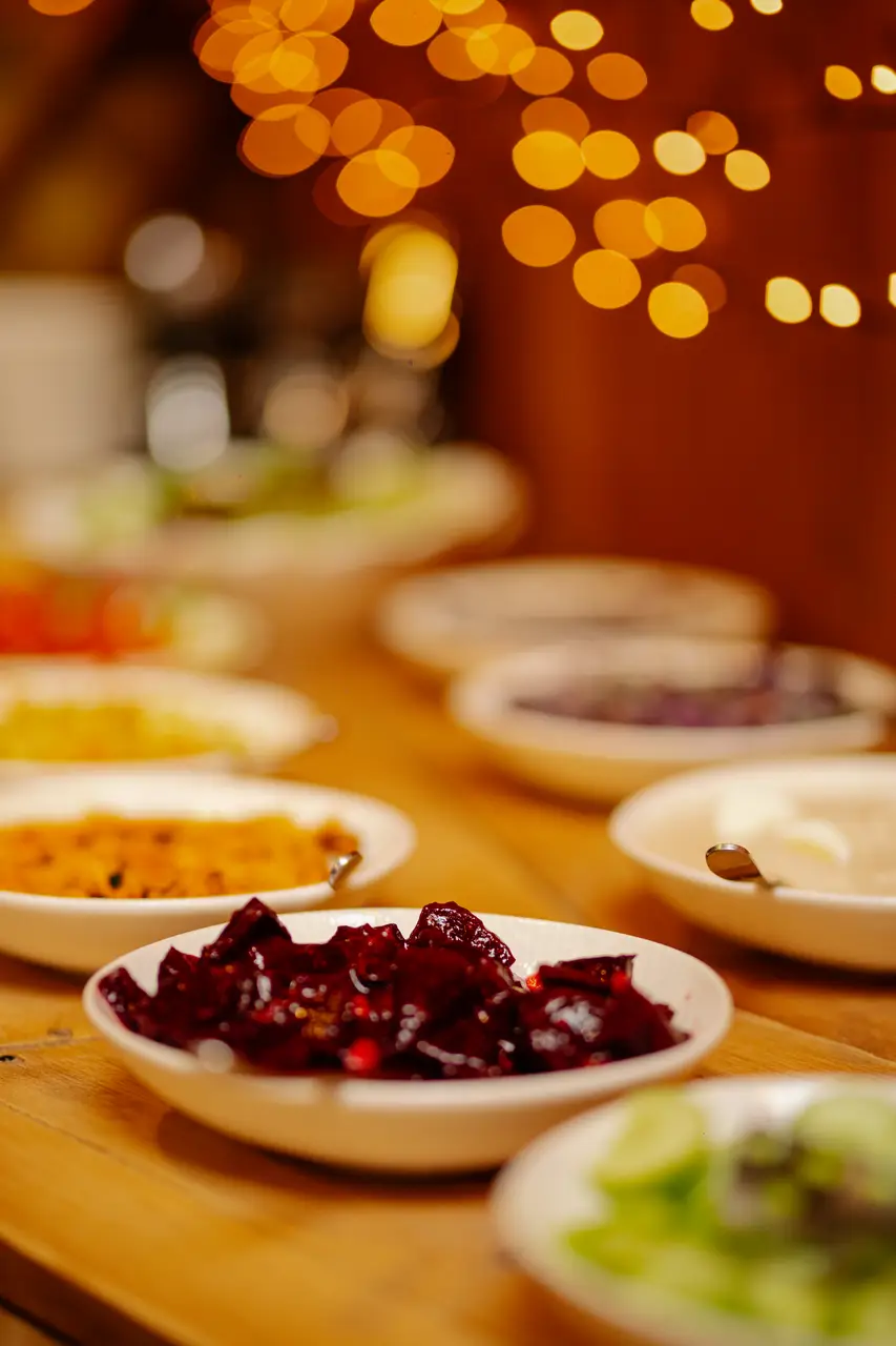 The vegetarian dinner buffet inside the Yurtalicious yurt under string lights